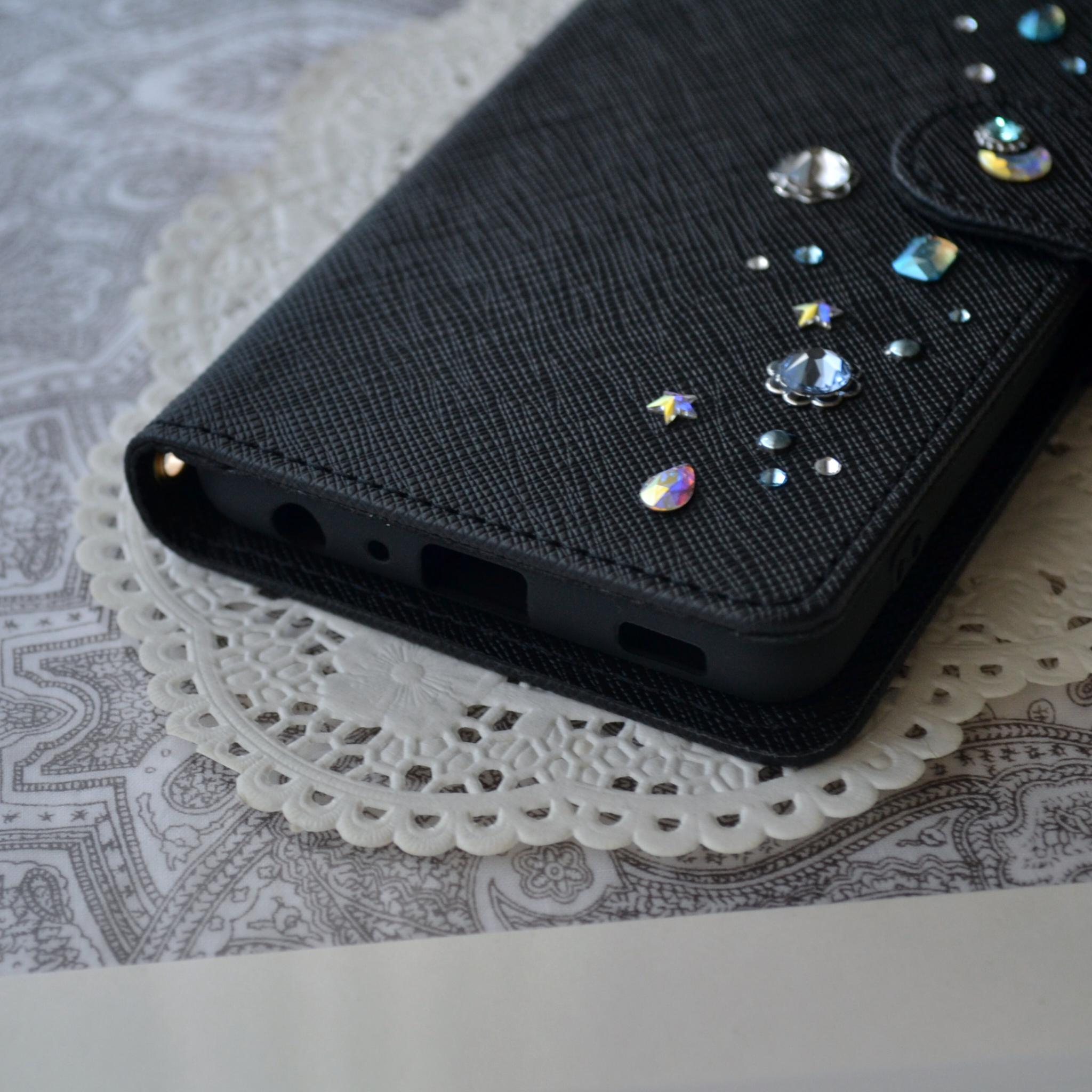 手帳型スマホケース『夜空のきらめき』水色とオーロラのクリスタル 漆黒のカバー　全機種対応　傷つきにくい型押し模様 | 3枚目