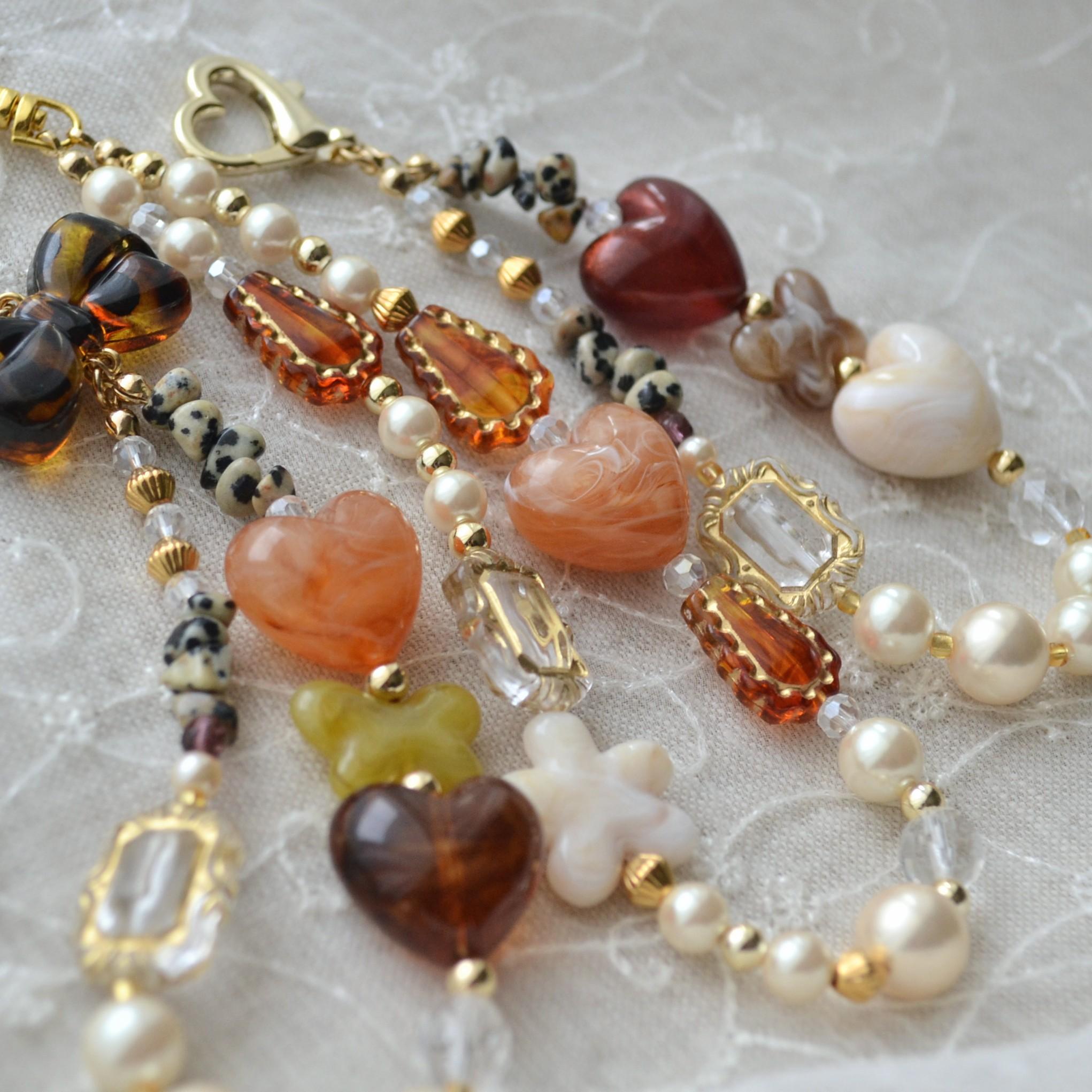 ぷっくりリボン、ハートやパールのスマホストラップ　マーブルオレンジ×べっ甲×クリームカーキ | 3枚目